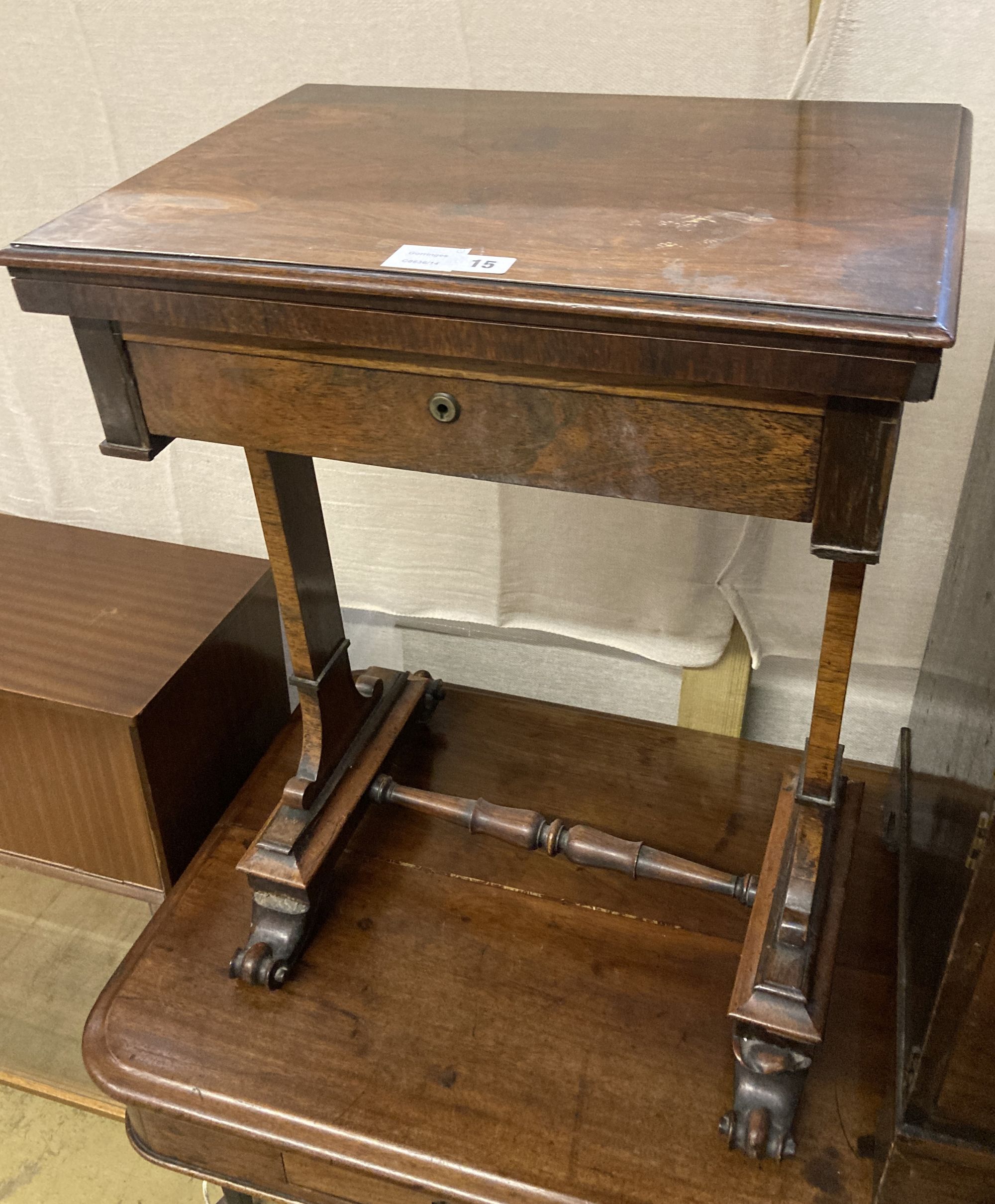 A Victorian rosewood work table, with a folding top, width 54cm depth 38cm height 71cm